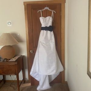 Wedding dress. David’s bridal.  Never worn.  Size 4.  Bagged in closet.